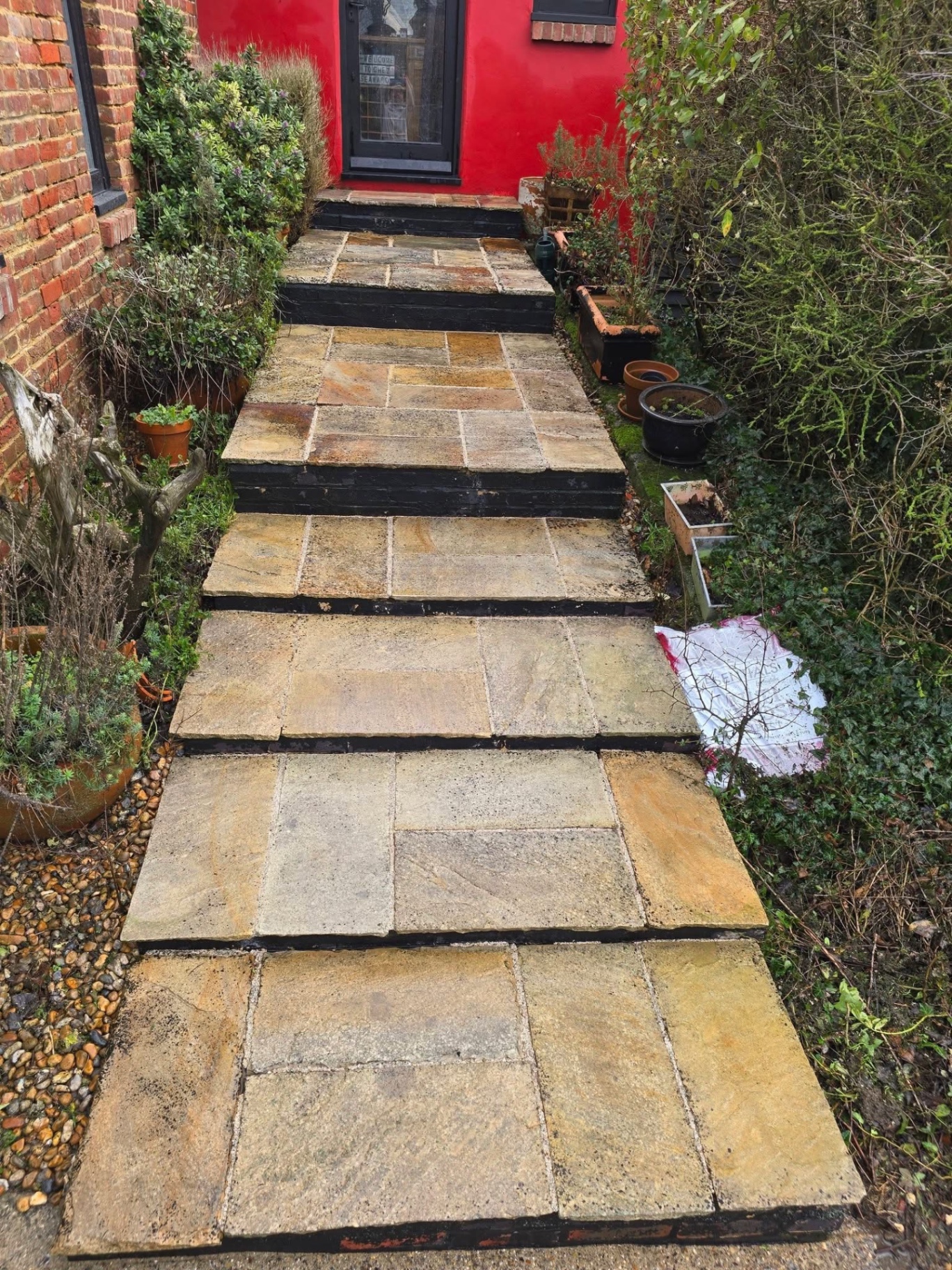 New Indian sandstone stepped pathway to a front door
